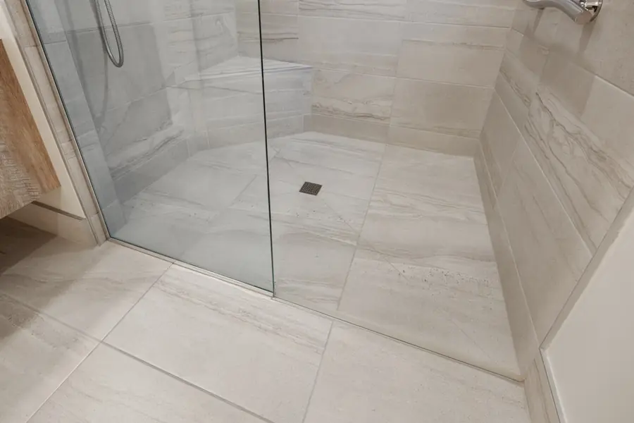 A tiled shower and floor, freshly set